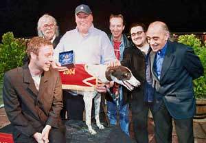Race 10 ‘The Siesta Stakes’ Blockheads Norman Watt-Roy, Lee Harris, Merlin Rhys Jones,  Derek Hussey and Baxter Dury present the winning trophy